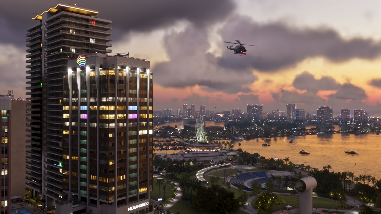 GTA 6'da gün batımında Vice City gökdelenleri ve şehrin üzerinde uçan helikopter